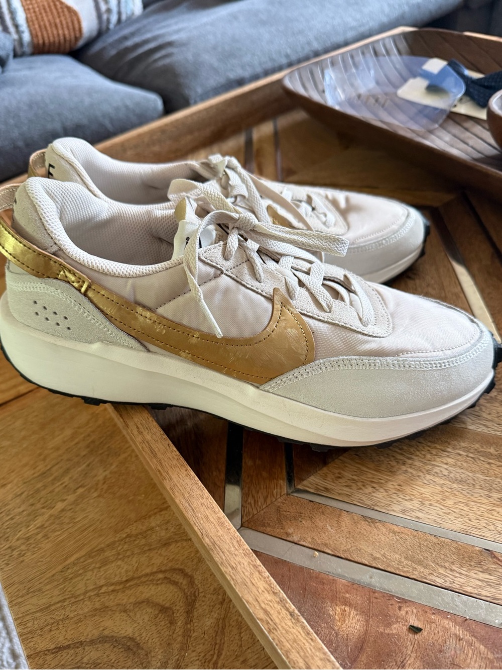 Nike Women’s Beige Sneaker with Gold Swoosh
Size 11 Womens